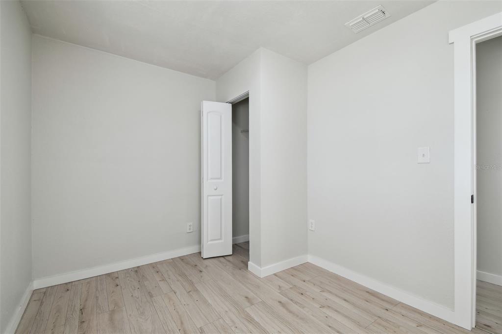 3414 Lindsey Street Dover, FL 33527 - Photo 39 of 45 a view of an empty room with wooden floor