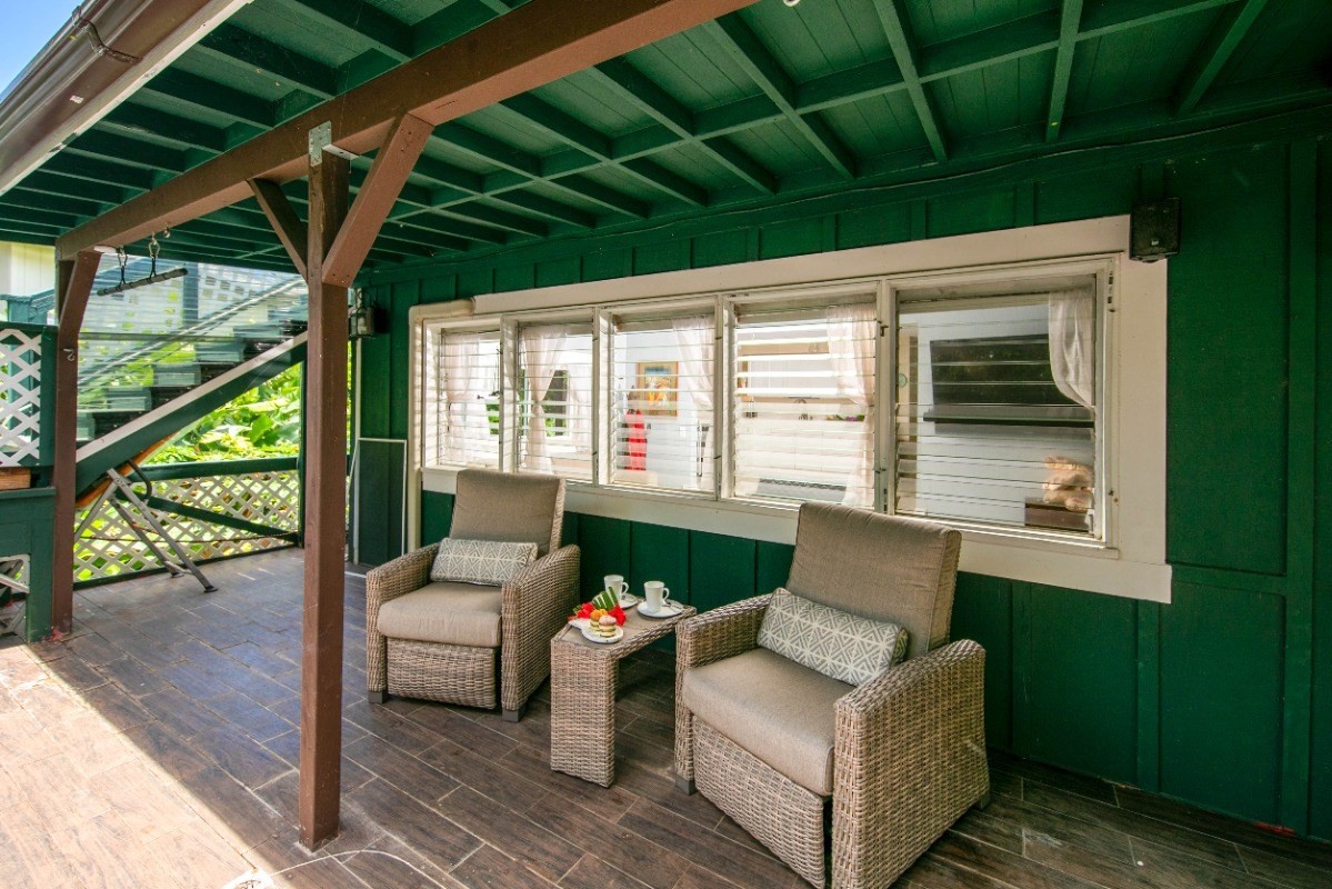 3590 Moloaa Road Kilauea, HI 96754 - Photo 15 of 22 a view of a patio with couches chairs and a potted plant