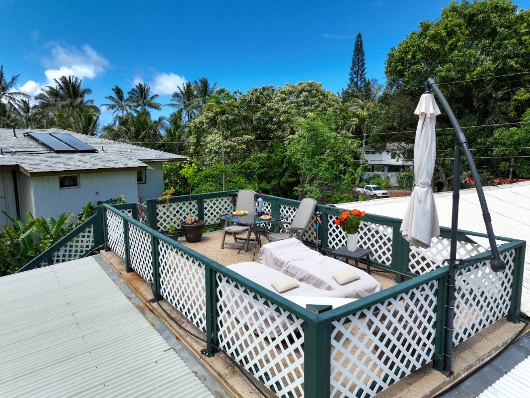 3590 Moloaa Road Kilauea, HI 96754 - Photo 16 of 22 a balcony with furniture and a potted plant