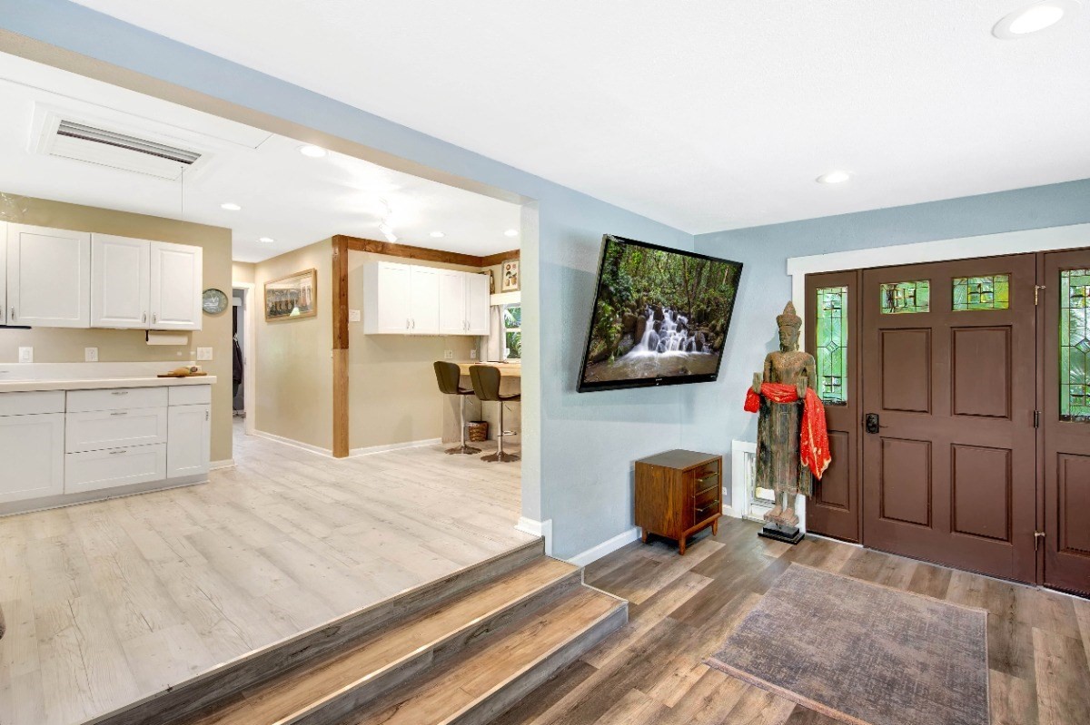 3590 Moloaa Road Kilauea, HI 96754 - Photo 2 of 22 a bedroom with a bed and a flat screen tv