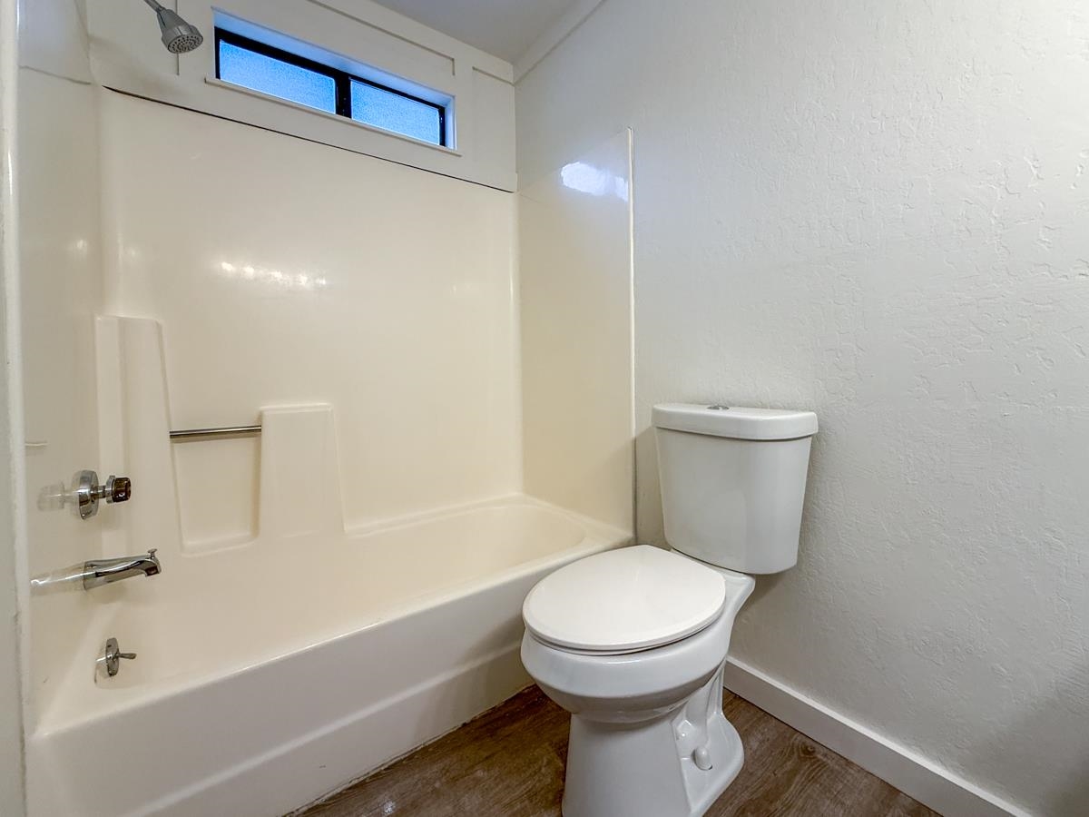 1560 Olympic Vly Road, Unit 14 Olympic Valley, CA 96146 - Photo 14 of 26 a white toilet sitting next to a bath tub