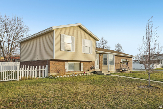 9571 David Street Sandy, UT 84070 - Photo 1 of 1 Split-level residence featuring a brick and siding exterior