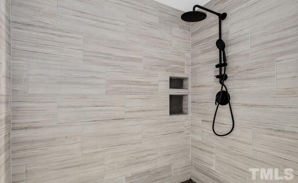 519 Barton Street Durham, NC 27707 - Photo 8 of 9 a bathroom with a shower