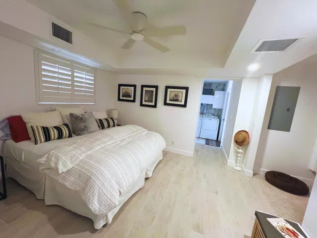 a bedroom with bed and a window