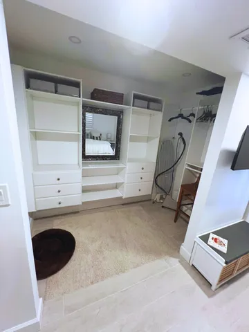 a view of a hardwood floor and a ceiling fan