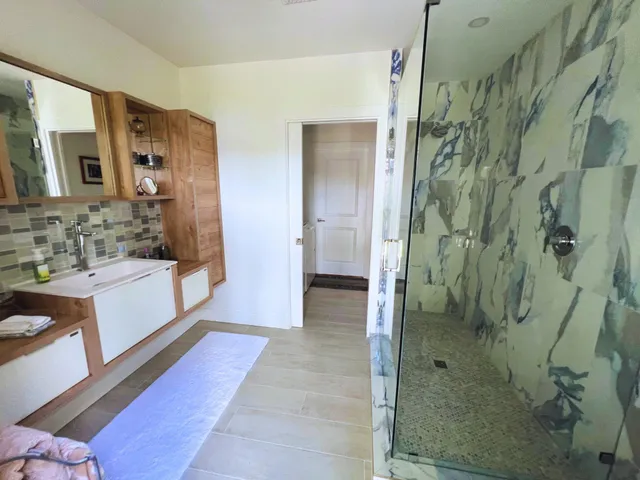 a bathroom with a bathtub and a sink