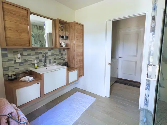 a bathroom with a sink and a mirror