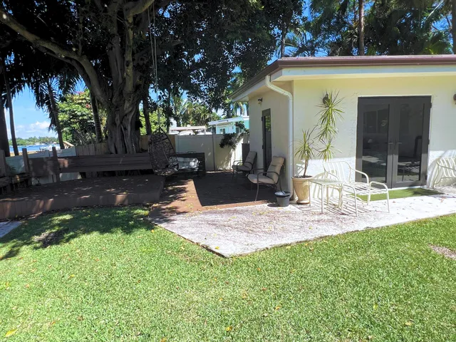 a front view of house with yard outdoor seating and green space