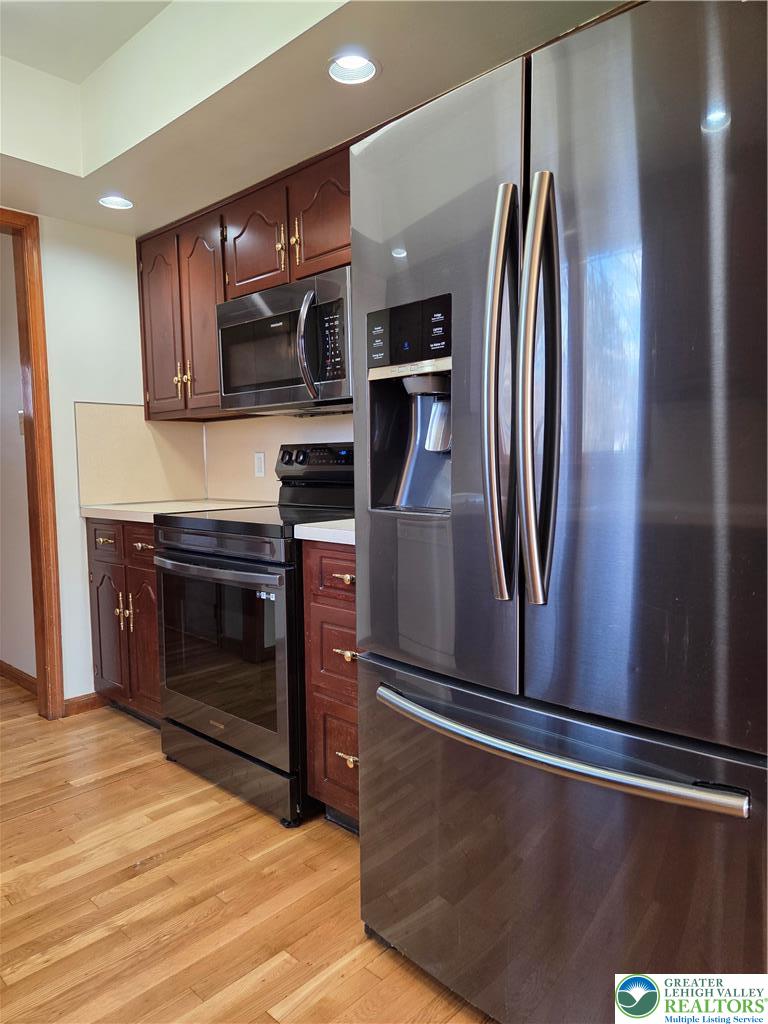 1728 Butztown Road, Unit C1 Bethlehem, PA 18017 - Photo 18 of 33 a kitchen with stainless steel appliances granite countertop a refrigerator and a stove