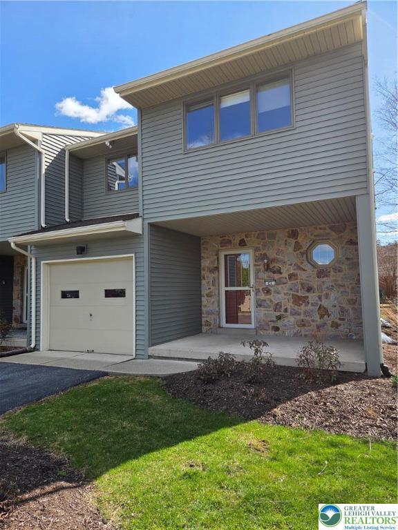 1728 Butztown Road, Unit C1 Bethlehem, PA 18017 - Photo 2 of 33 a front view of a house with garden