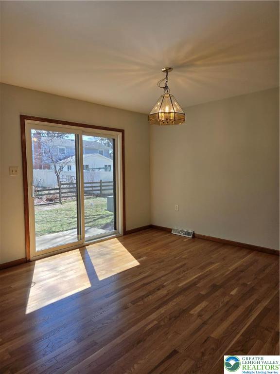 1728 Butztown Road, Unit C1 Bethlehem, PA 18017 - Photo 22 of 33 a view of an empty room with wooden floor and a window