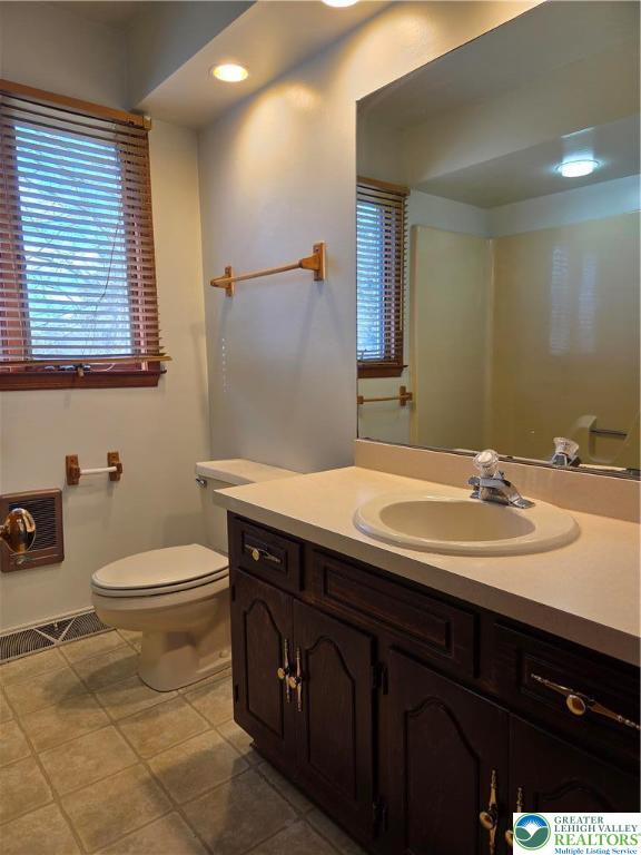 1728 Butztown Road, Unit C1 Bethlehem, PA 18017 - Photo 27 of 33 a bathroom with a sink a toilet and mirror