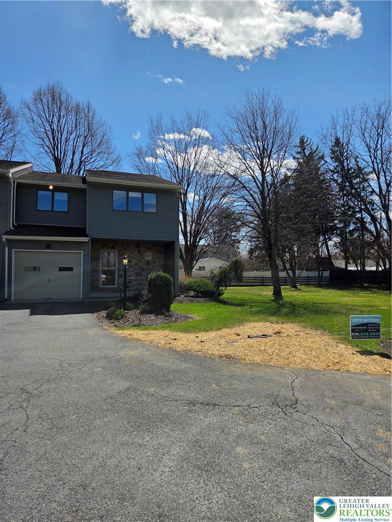 1728 Butztown Road, Unit C1 Bethlehem, PA 18017 - Photo 7 of 33 a view of a house with a yard and garage