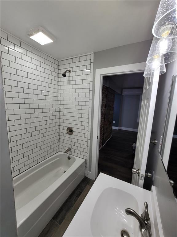 313 Mercer Street Butler, PA 16001 - Photo 6 of 12 a bathroom with a sink and a bathtub