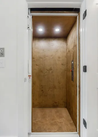 a view of a room with a wooden floor