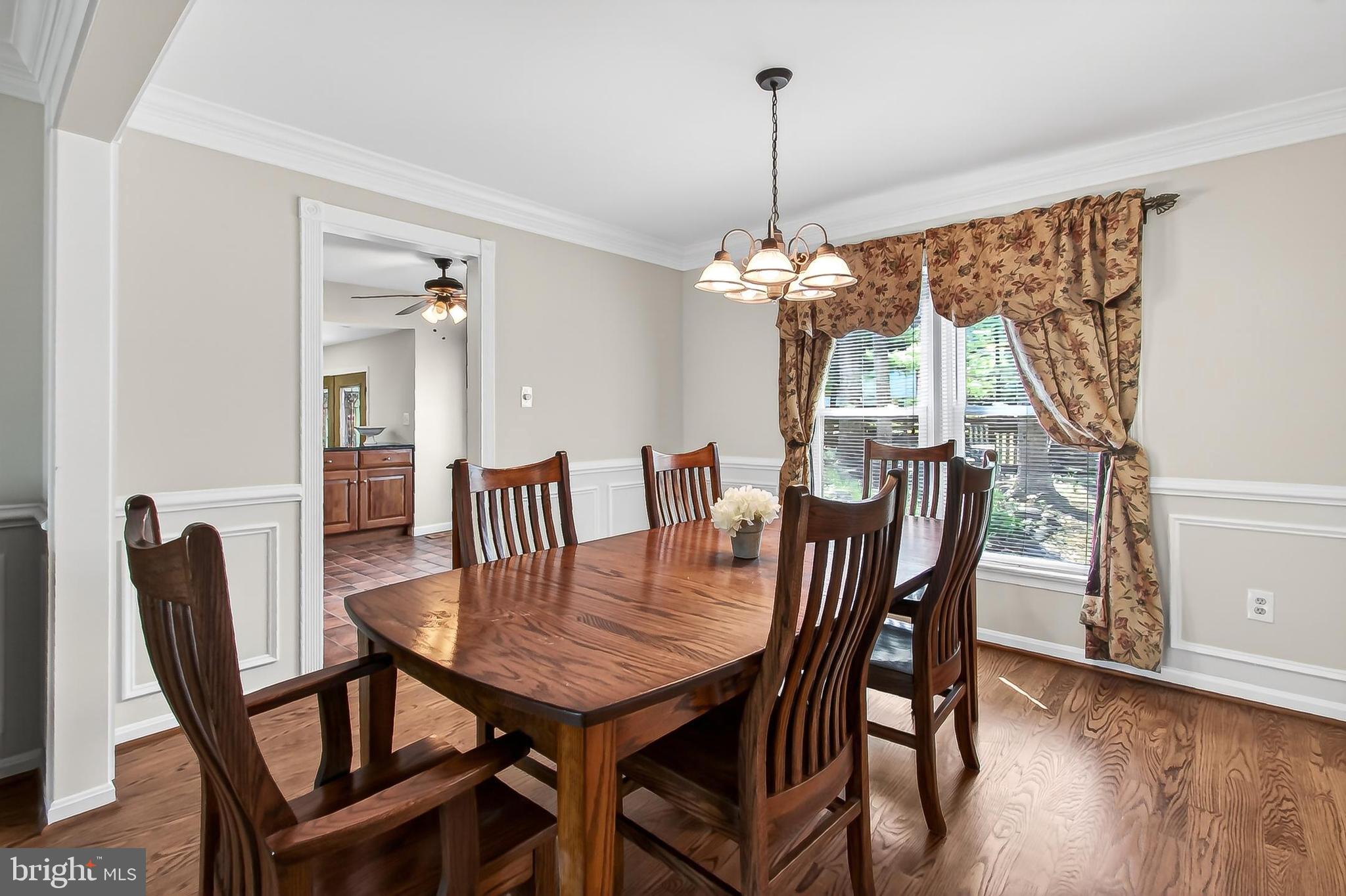 15117 Philip Lee Road Chantilly, VA 20151 - Photo 15 of 71 a view of a dining room with furniture window and wooden floor