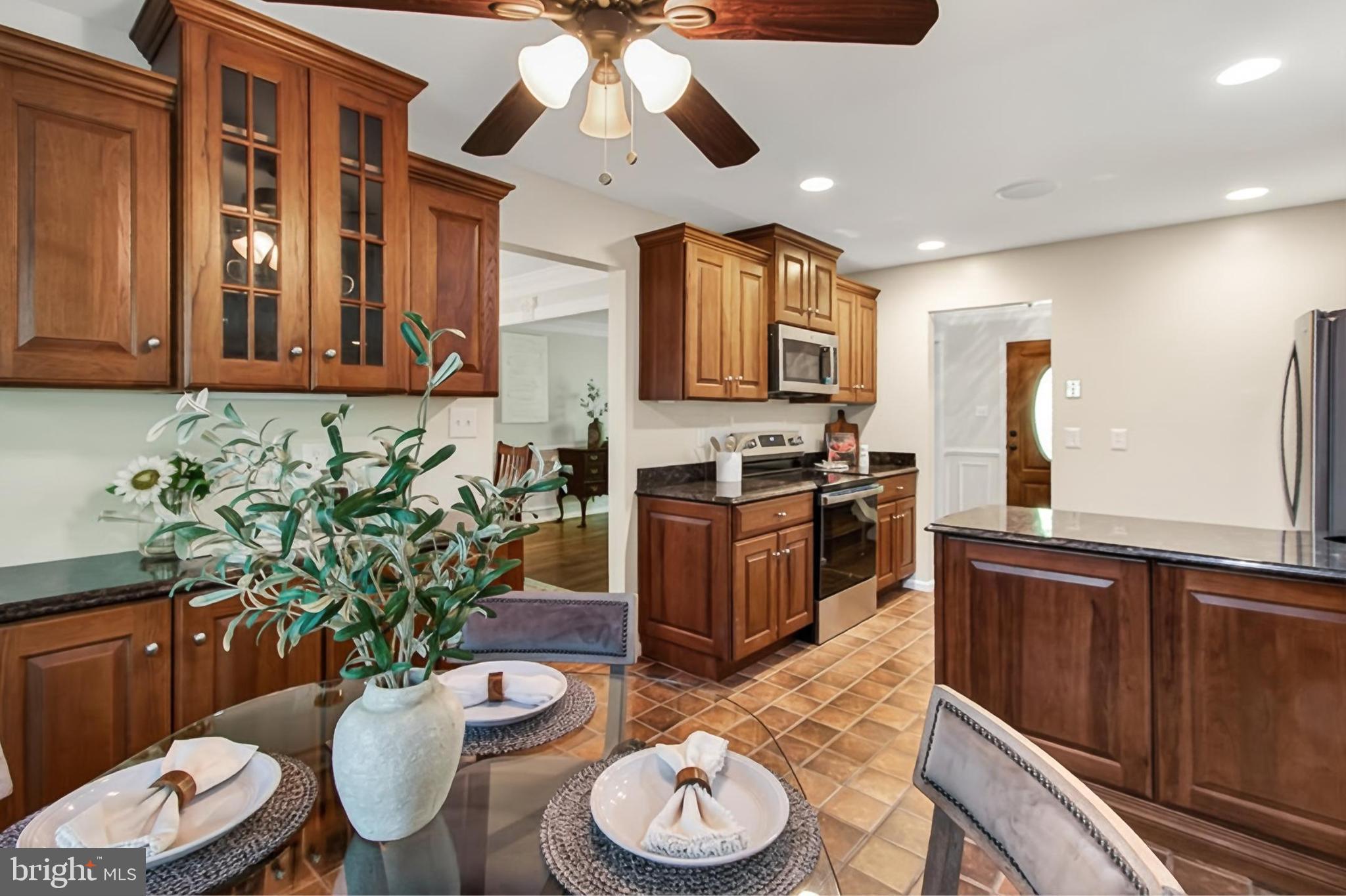 15117 Philip Lee Road Chantilly, VA 20151 - Photo 21 of 80 a kitchen with a table and chairs in it