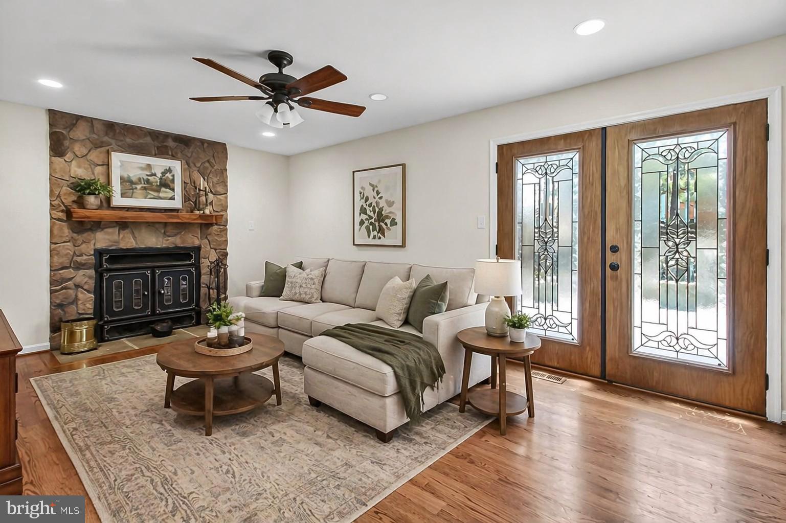 15117 Philip Lee Road Chantilly, VA 20151 - Photo 25 of 71 a living room with furniture a large window and a fireplace
