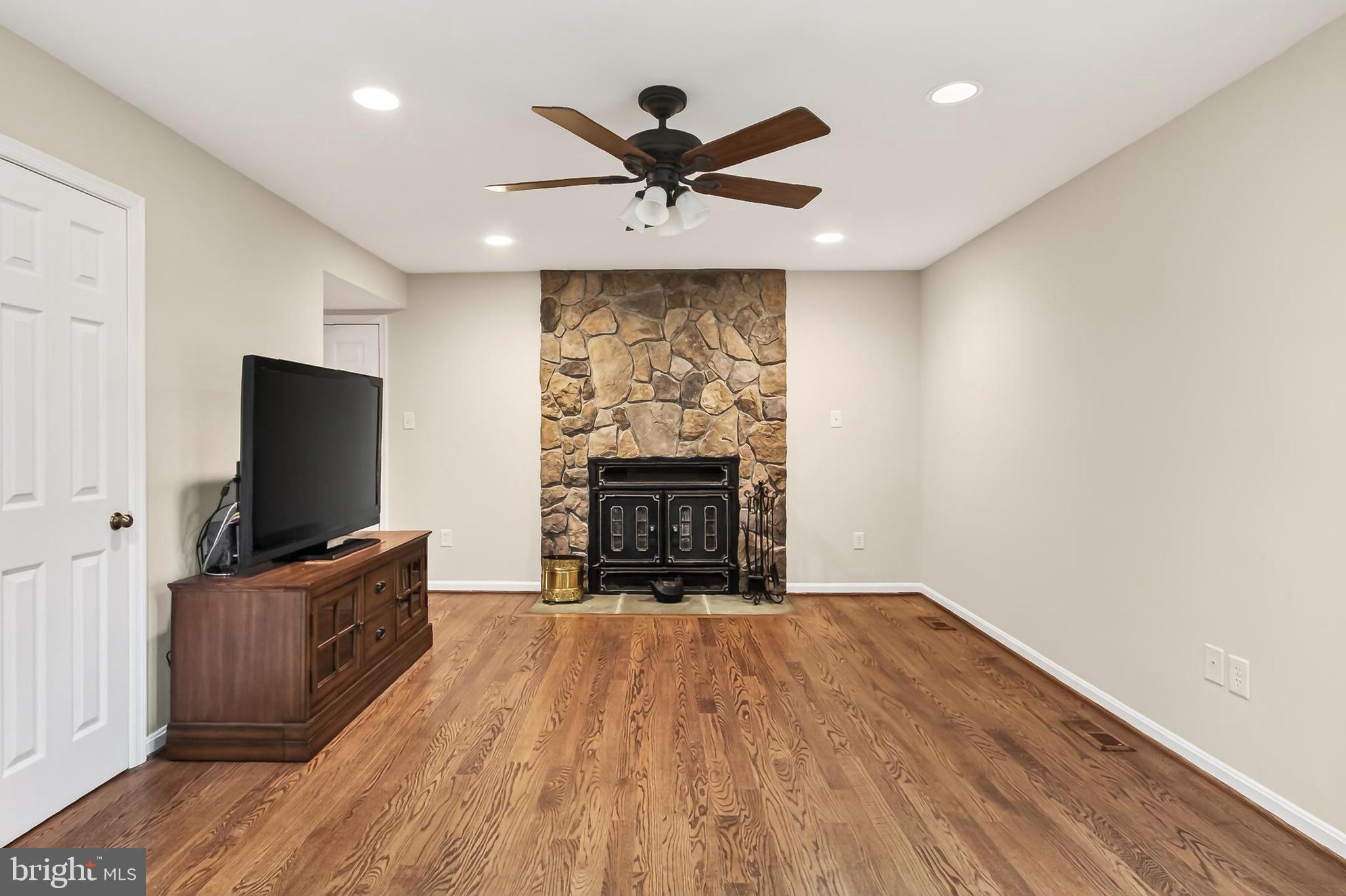 15117 Philip Lee Road Chantilly, VA 20151 - Photo 26 of 80 a living room with furniture and a flat screen tv