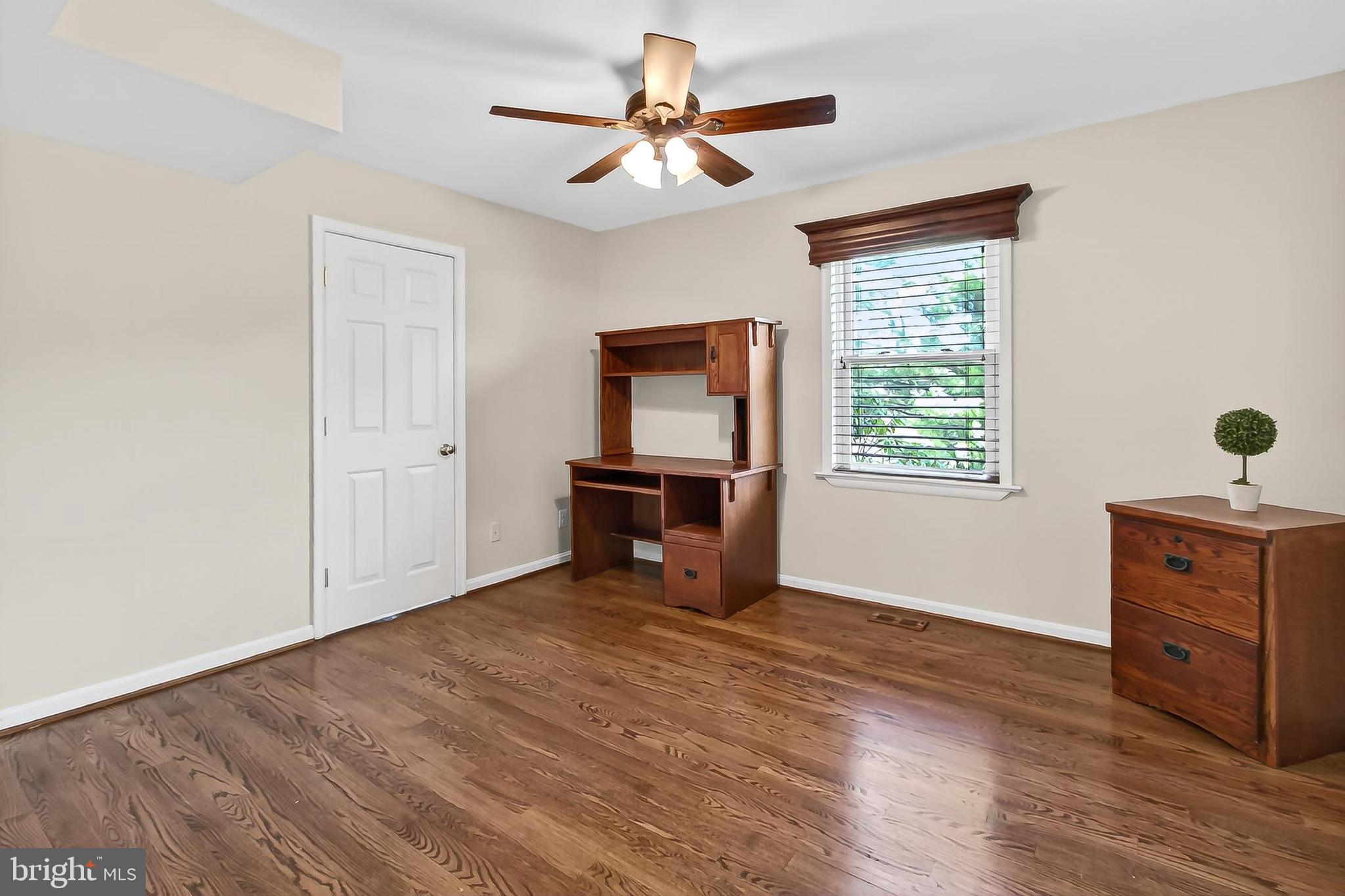 15117 Philip Lee Road Chantilly, VA 20151 - Photo 29 of 71 a view of an empty room with a window and wooden floor