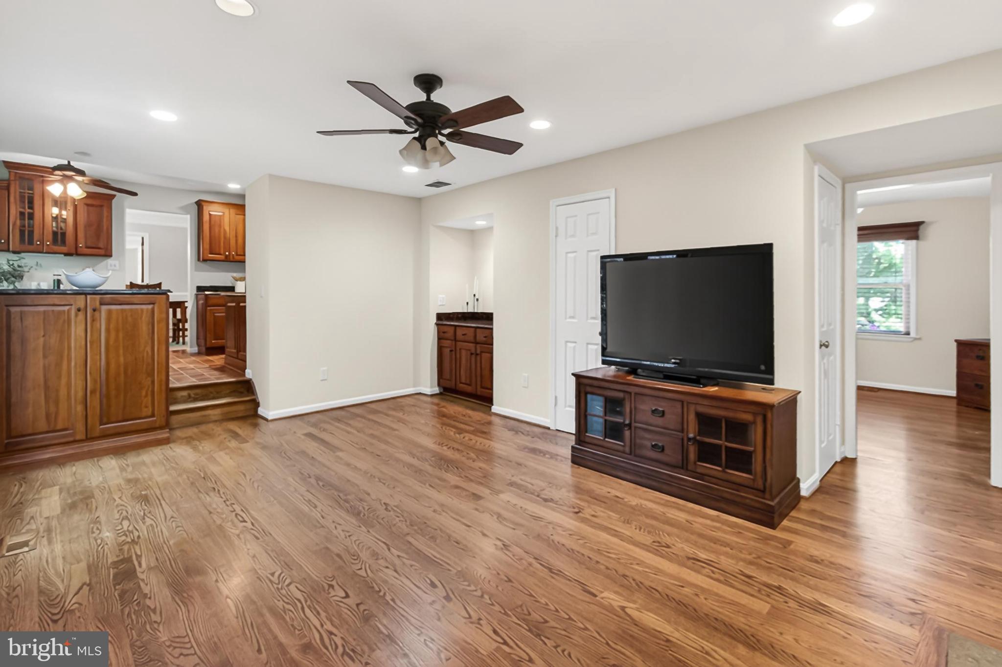 15117 Philip Lee Road Chantilly, VA 20151 - Photo 29 of 80 a living room with furniture and a flat screen tv