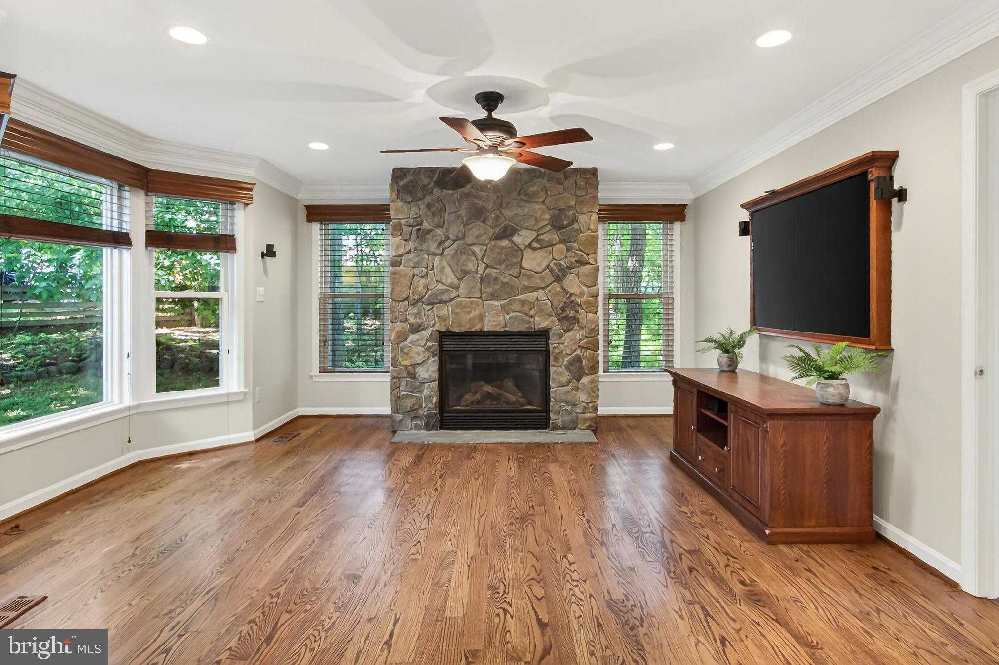 15117 Philip Lee Road Chantilly, VA 20151 - Photo 32 of 80 a living room with fireplace furniture and a flat screen tv