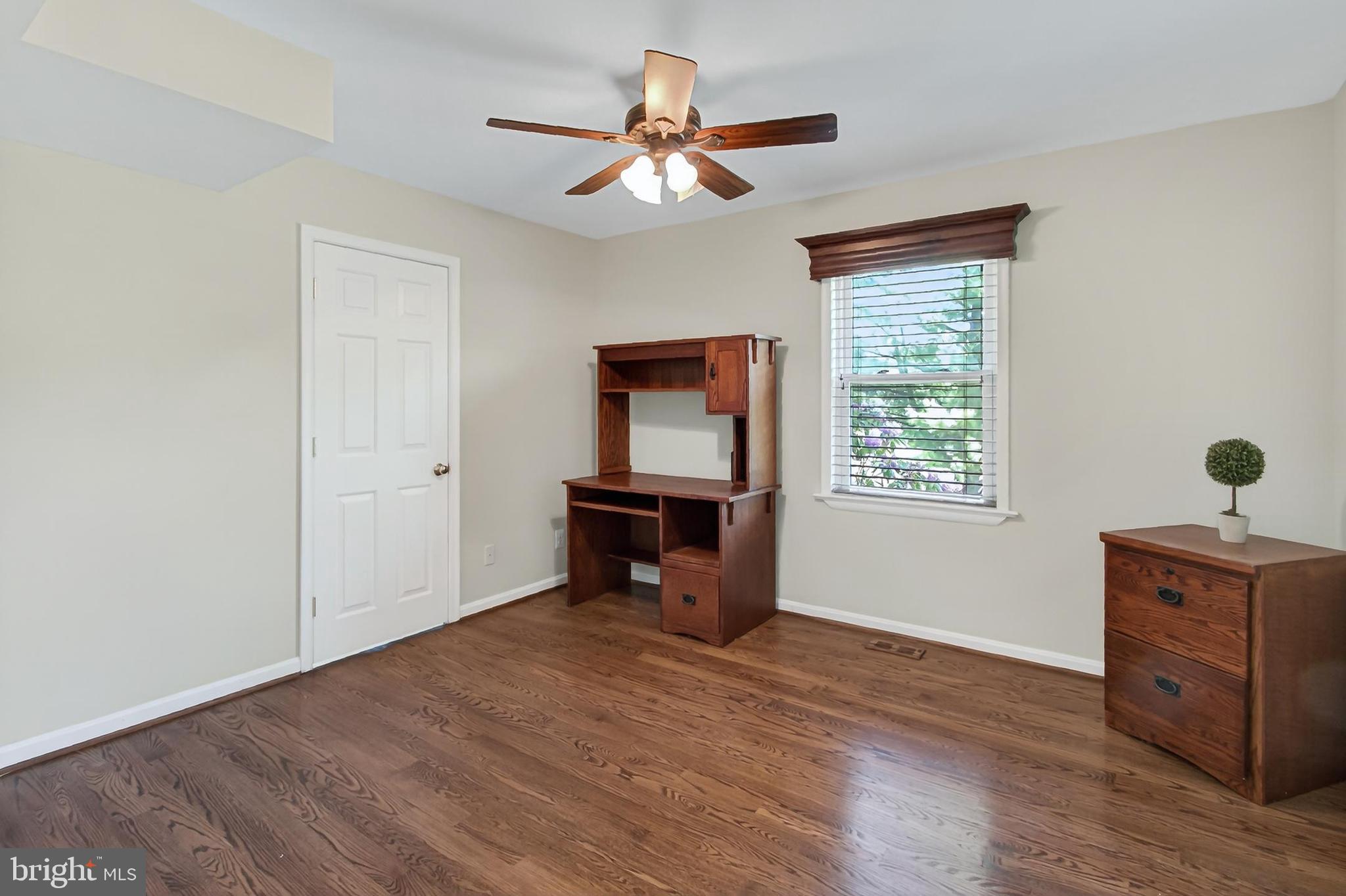 15117 Philip Lee Road Chantilly, VA 20151 - Photo 34 of 80 a view of an empty room with a window and wooden floor