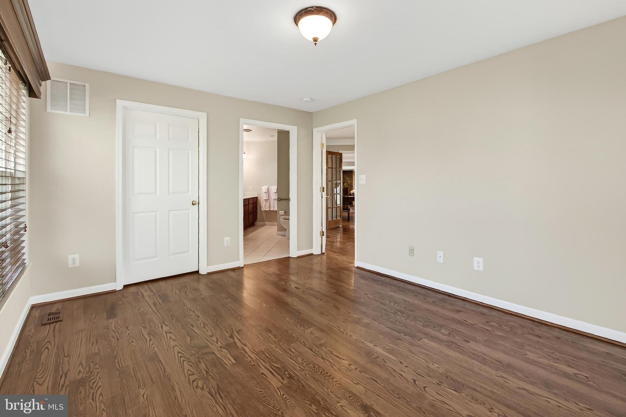 15117 Philip Lee Road Chantilly, VA 20151 - Photo 37 of 71 a view of an empty room with wooden floor and a window