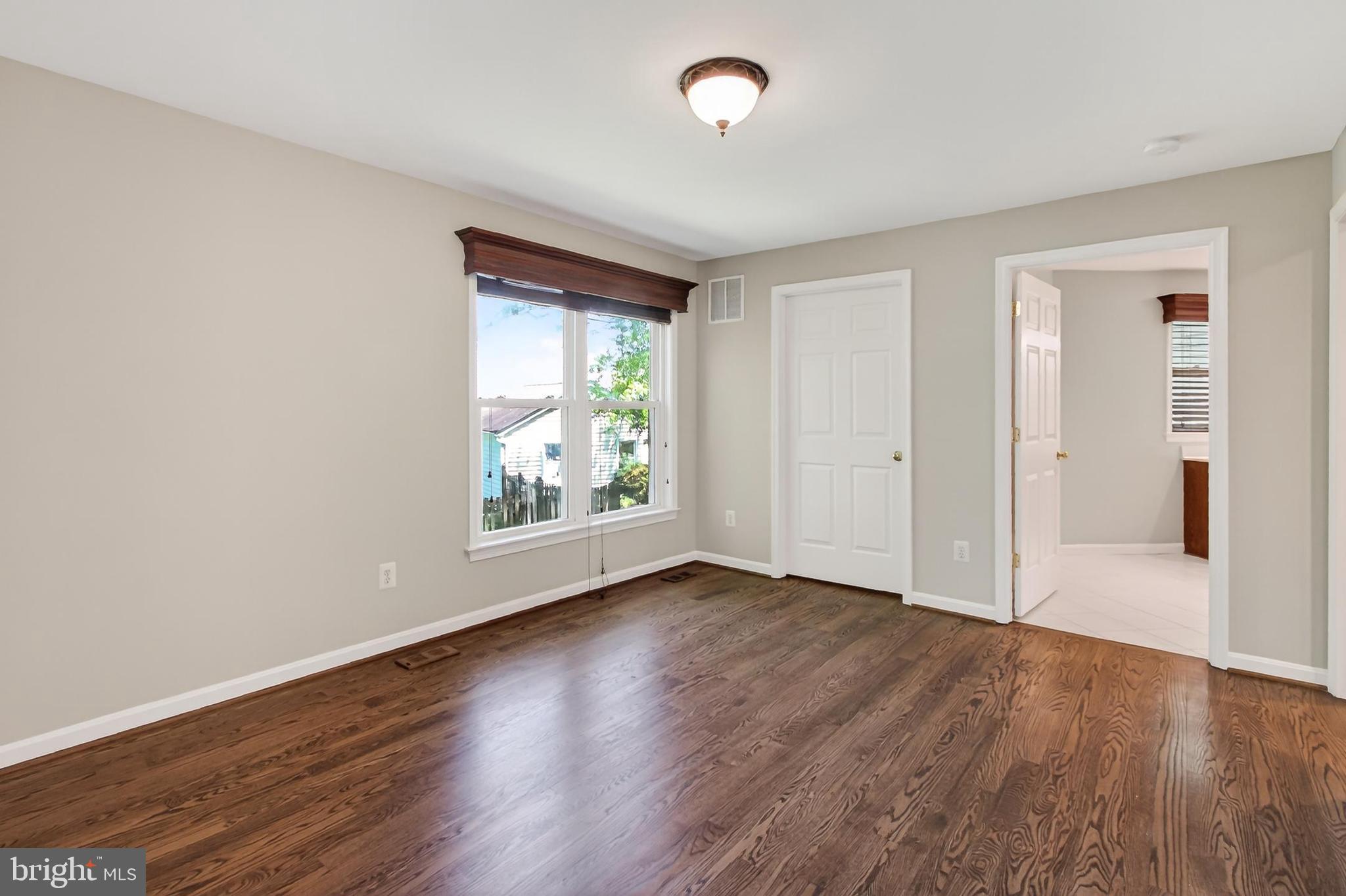 15117 Philip Lee Road Chantilly, VA 20151 - Photo 40 of 80 an empty room with wooden floor and windows