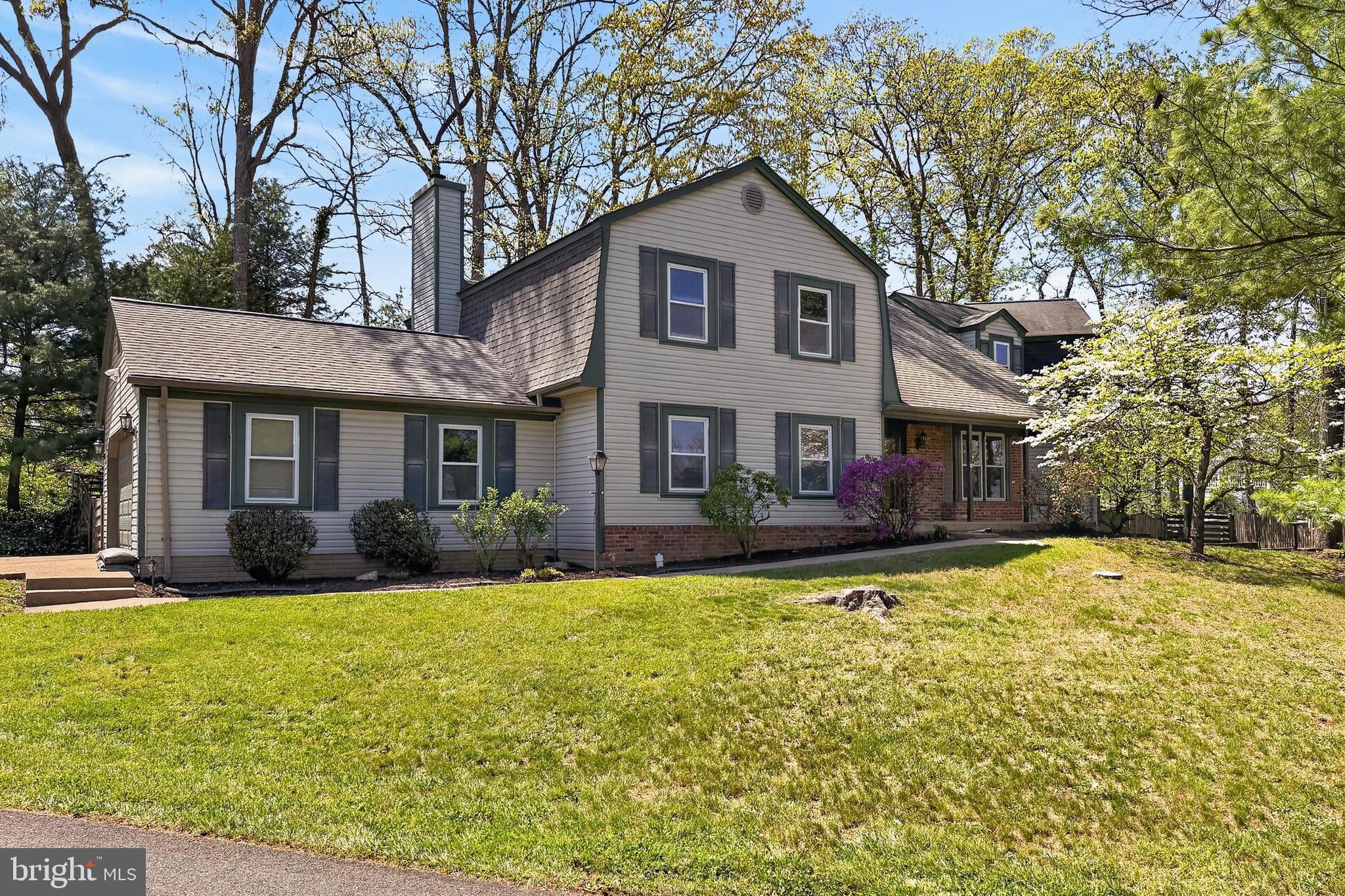 15117 Philip Lee Road Chantilly, VA 20151 - Photo 4 of 80 a front view of a house with a yard