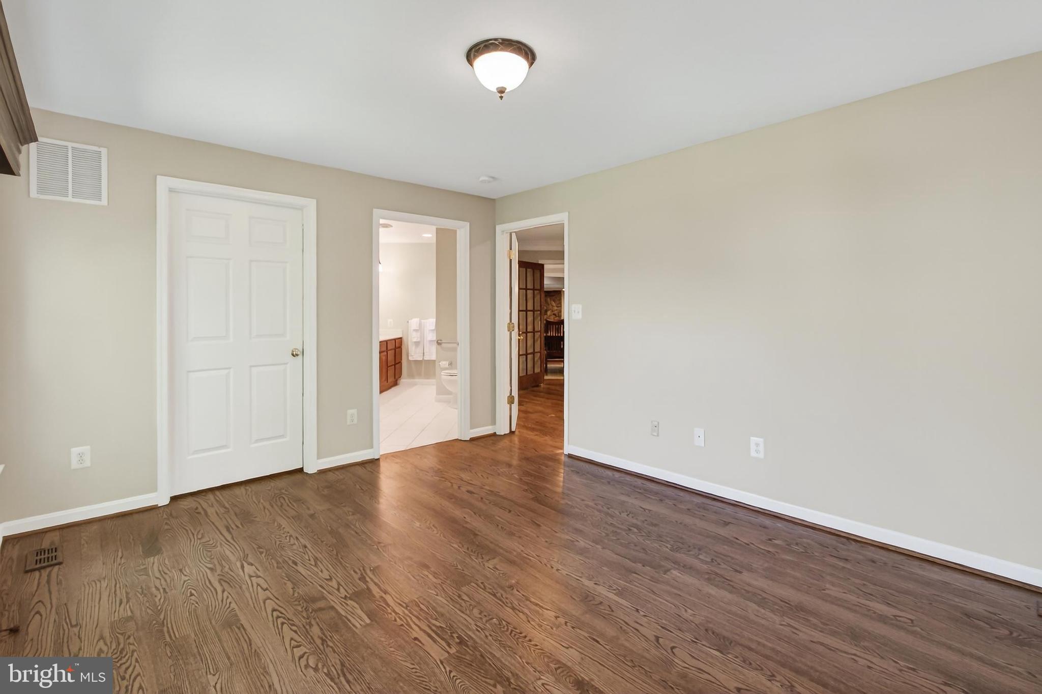 15117 Philip Lee Road Chantilly, VA 20151 - Photo 41 of 80 an empty room with wooden floor and windows