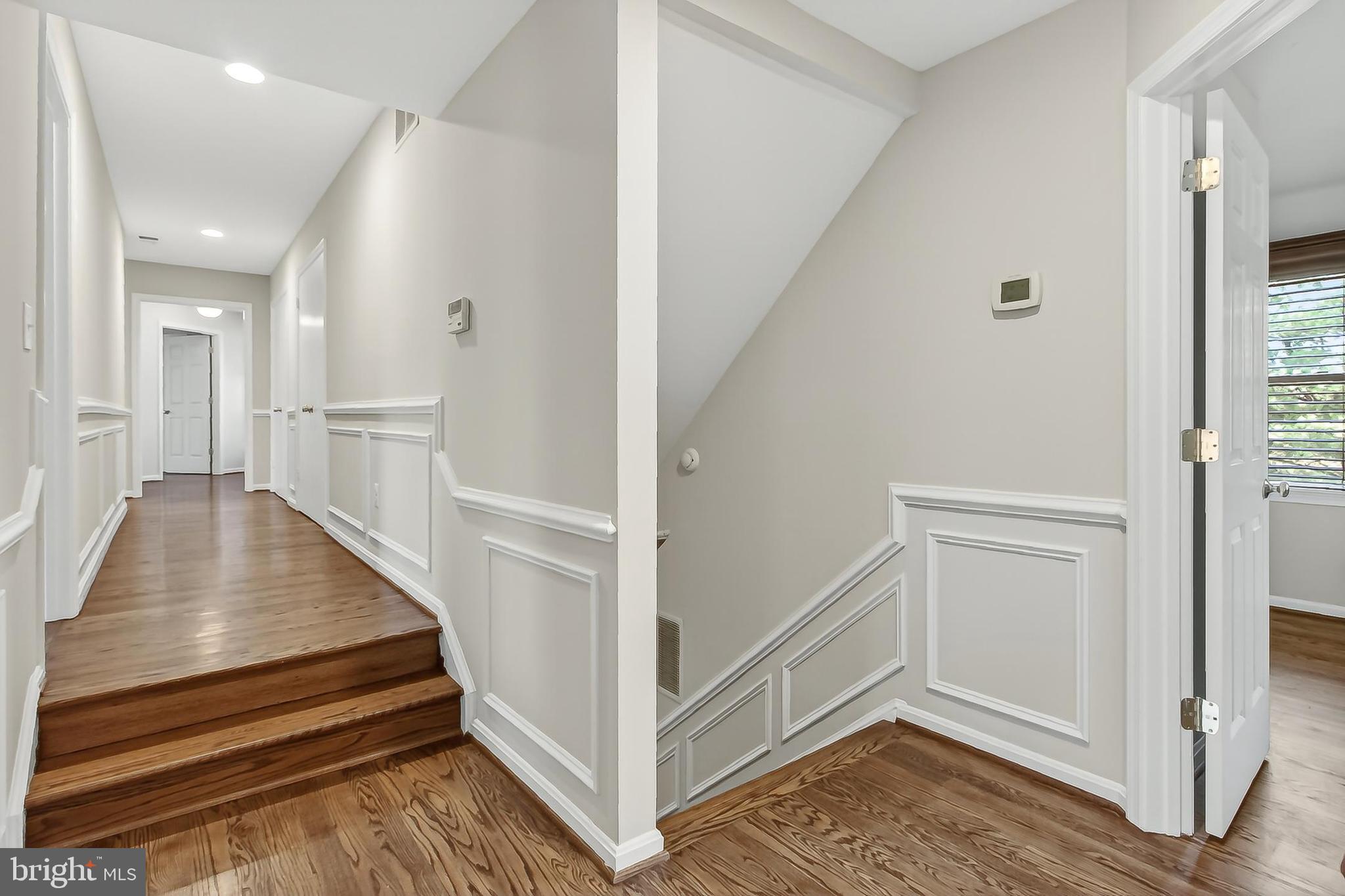 15117 Philip Lee Road Chantilly, VA 20151 - Photo 43 of 71 a view of a hallway with closet and wooden floor