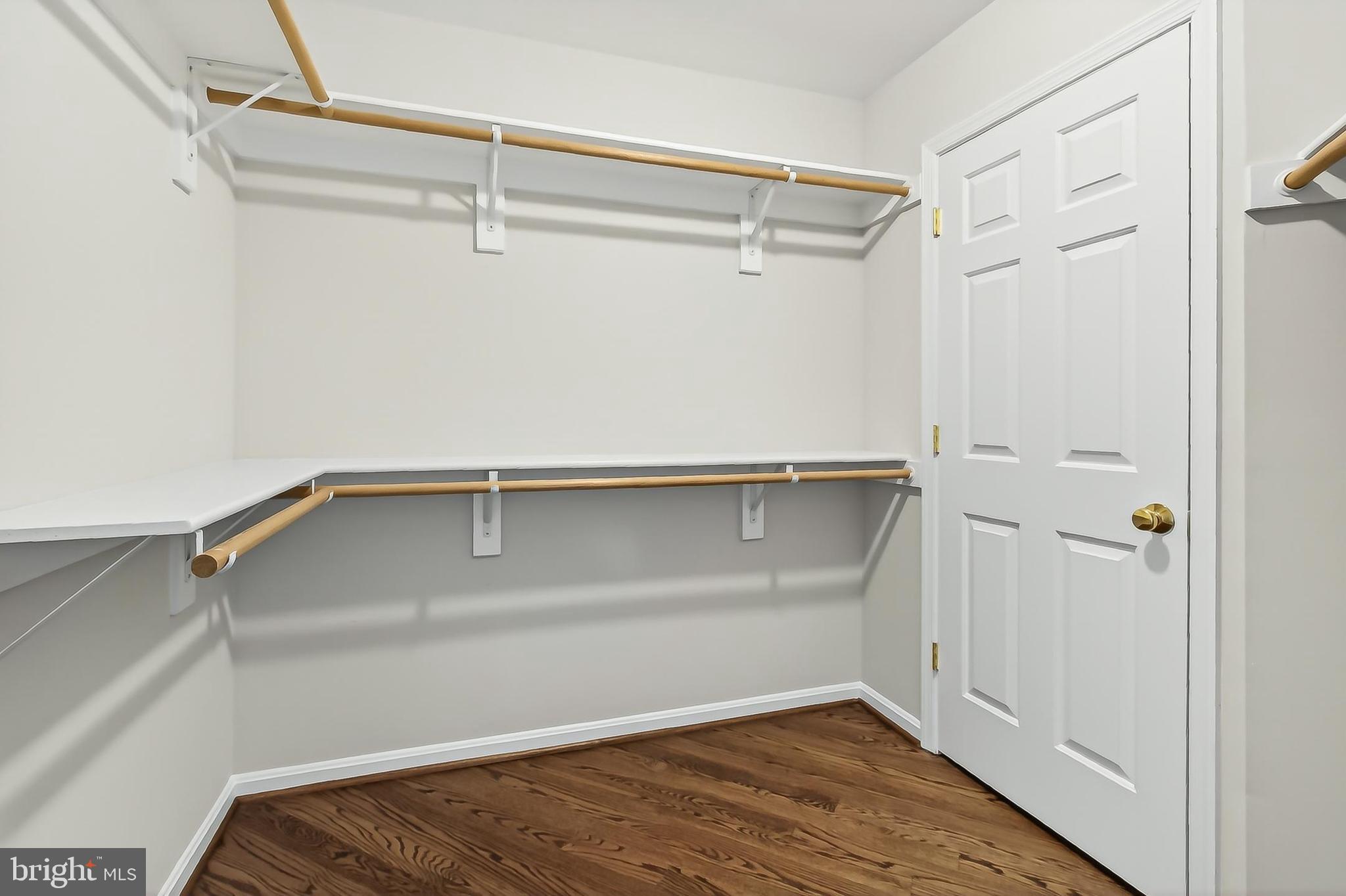 15117 Philip Lee Road Chantilly, VA 20151 - Photo 50 of 71 a view of walk in closet with empty racks