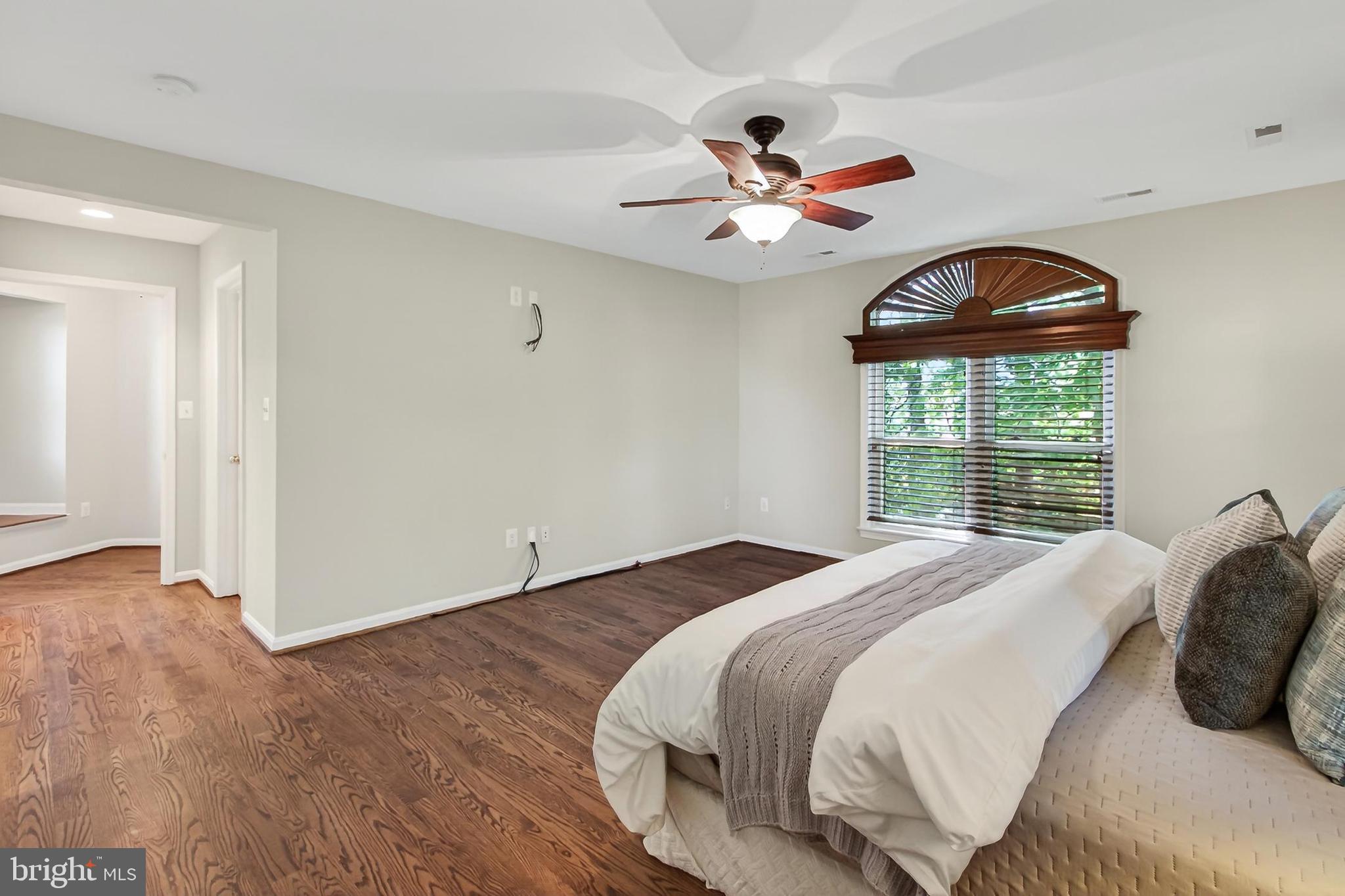 15117 Philip Lee Road Chantilly, VA 20151 - Photo 50 of 80 a bedroom with a large bed and a window