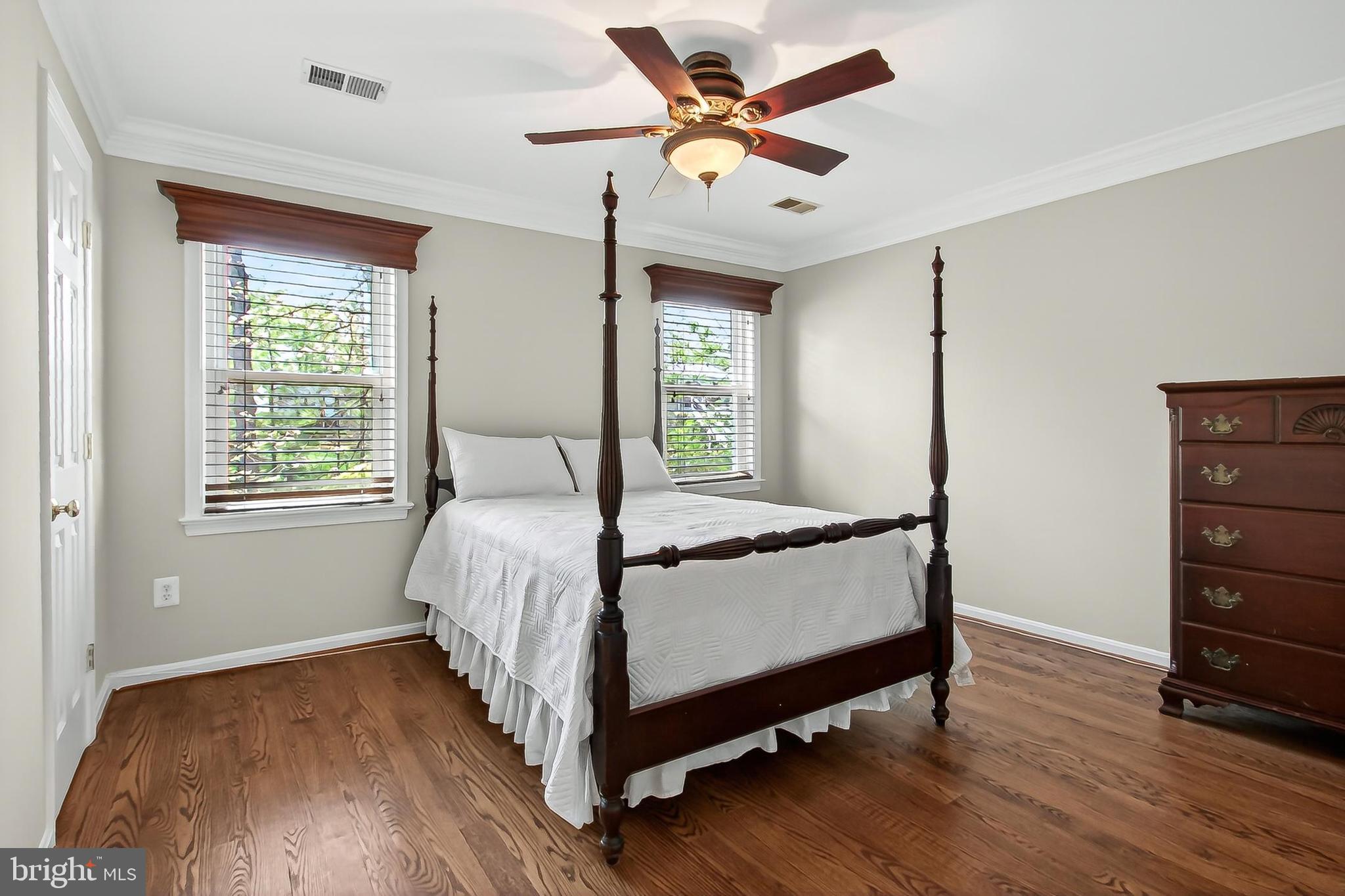 15117 Philip Lee Road Chantilly, VA 20151 - Photo 52 of 71 a bed sitting in a spacious bedroom next to a window