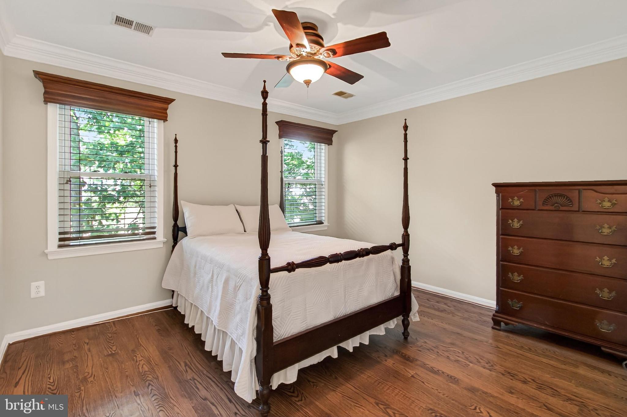 15117 Philip Lee Road Chantilly, VA 20151 - Photo 59 of 80 a bedroom with a bed and a ceiling fan