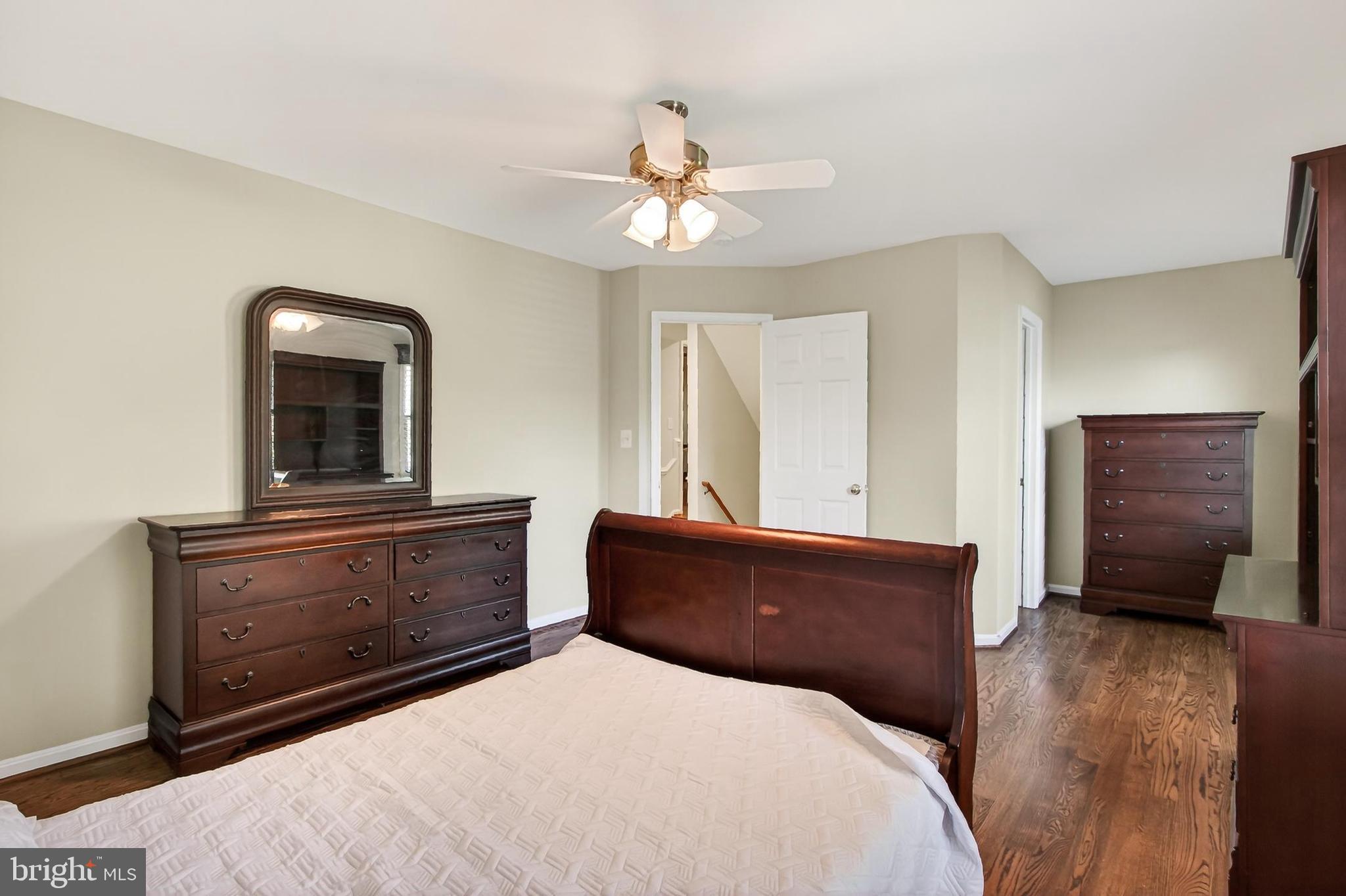 15117 Philip Lee Road Chantilly, VA 20151 - Photo 65 of 80 a bedroom with a bed and a dresser