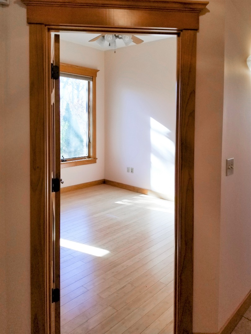 61 Edgartown Meadows Road Edgartown, MA 02539 - Photo 22 of 48 a view of an empty room with wooden floor and a window