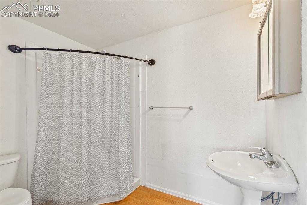 621 Edison Avenue La Junta, CO 81050 - Photo 12 of 30 a bathroom with a sink and a mirror