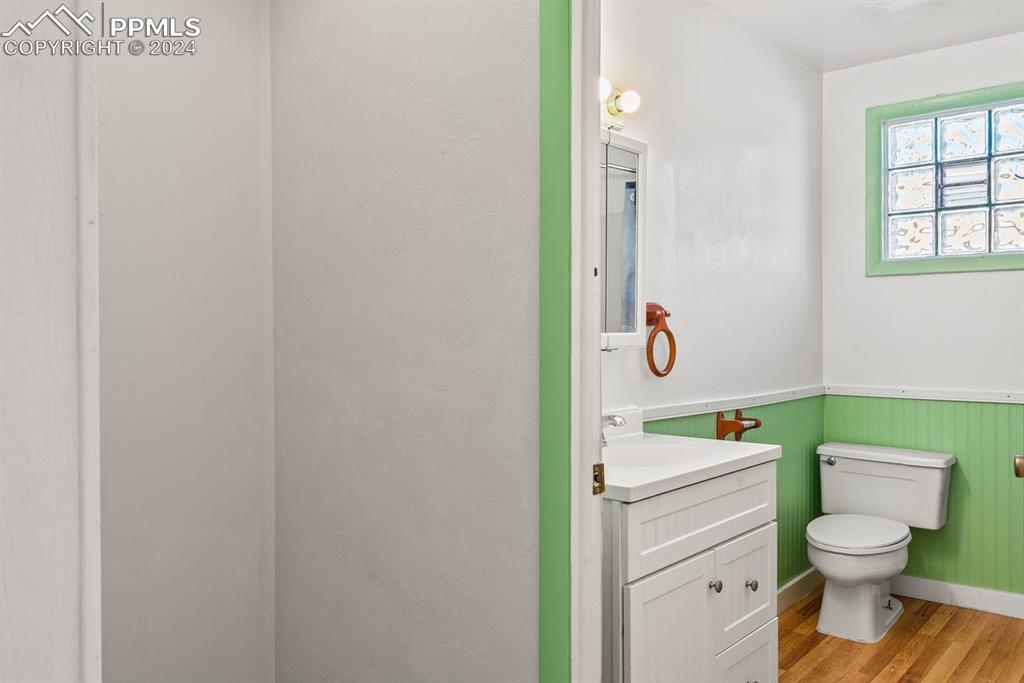 621 Edison Avenue La Junta, CO 81050 - Photo 19 of 30 a bathroom with a toilet sink and a mirror
