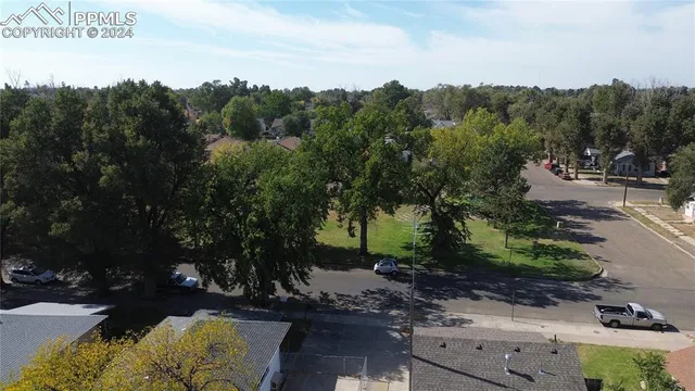 a view of a street with a building in the background