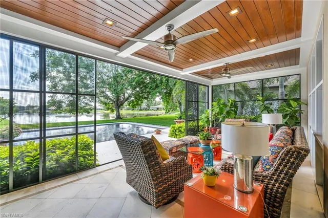a view of a patio with chairs and a table