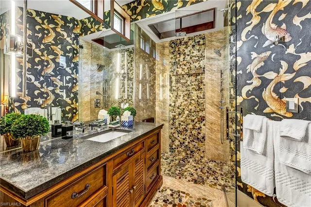a bath room with a sink and a shower curtain