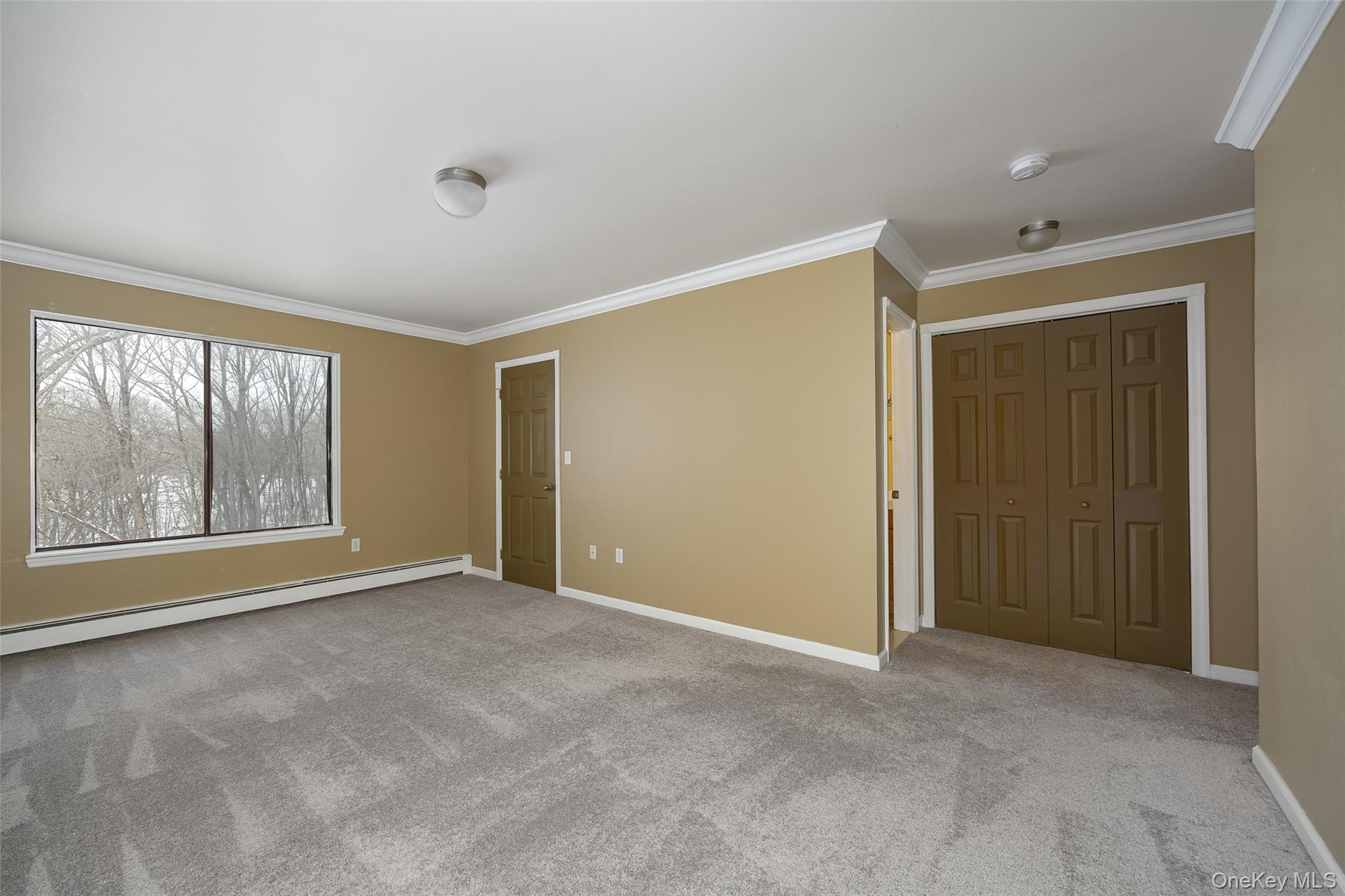 3 Hook Road, Unit 72H Poughkeepsie, NY 12601 - Photo 11 of 23 Spacious room featuring an en-suite bath and elegant crown molding