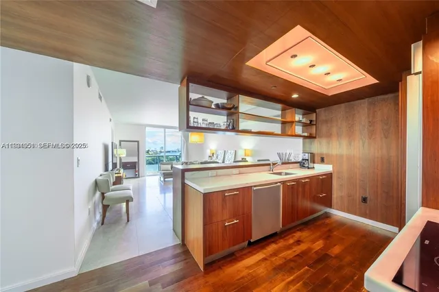 a kitchen with stainless steel appliances granite countertop a stove and a refrigerator