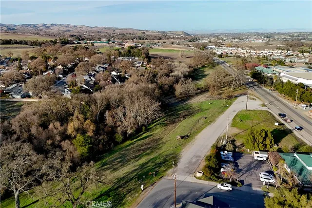 an aerial view of a residential houses with outdoor space