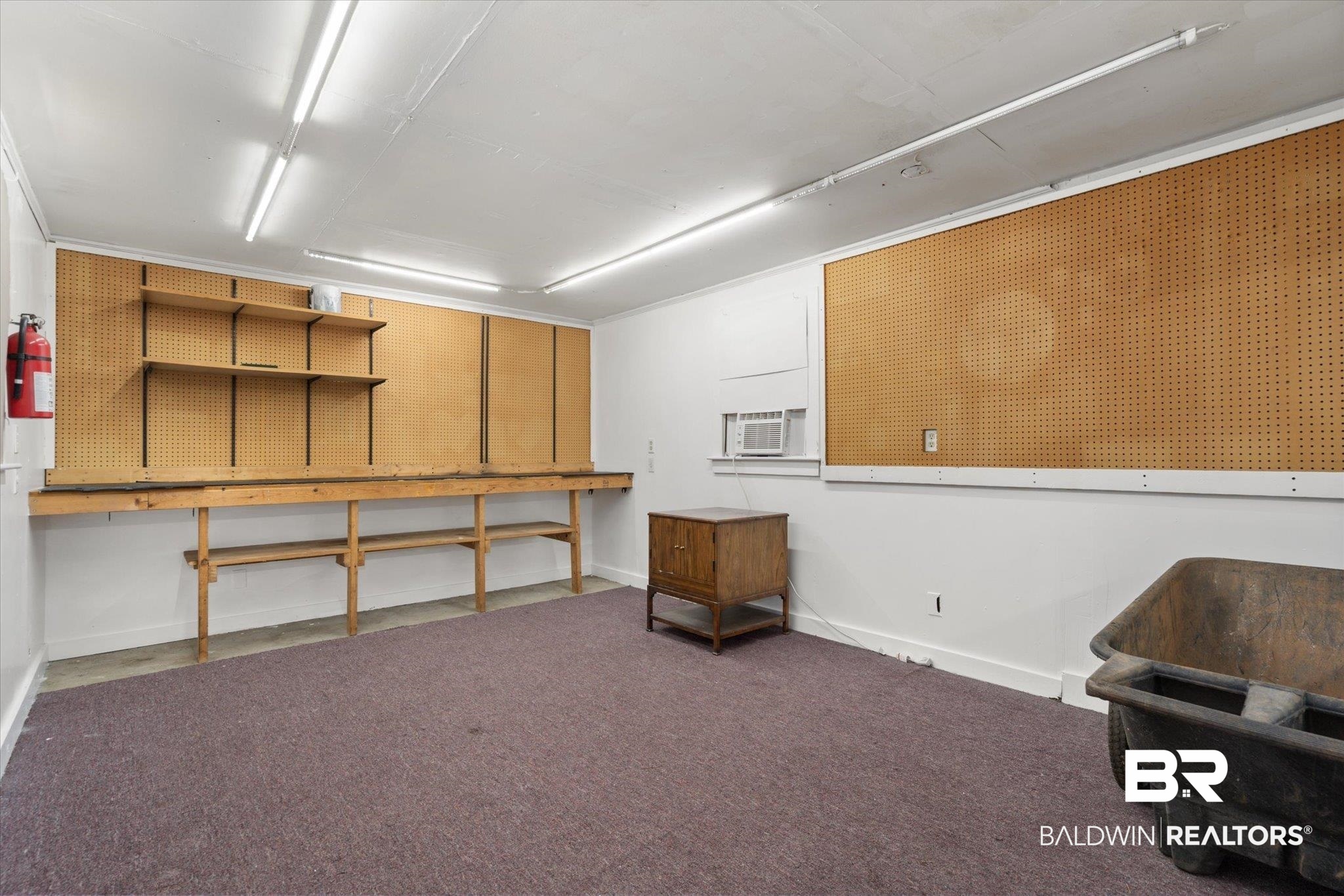 24 Macy Place Mobile, AL 36604 - Photo 34 of 38 Basement with a workshop area and baseboards