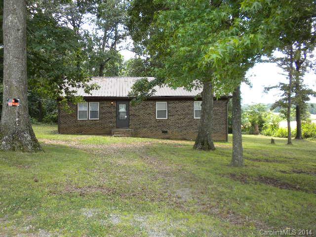 6918 Medlin Road Monroe, NC 28112 - Photo 1 of 11 a front view of a house with a yard
