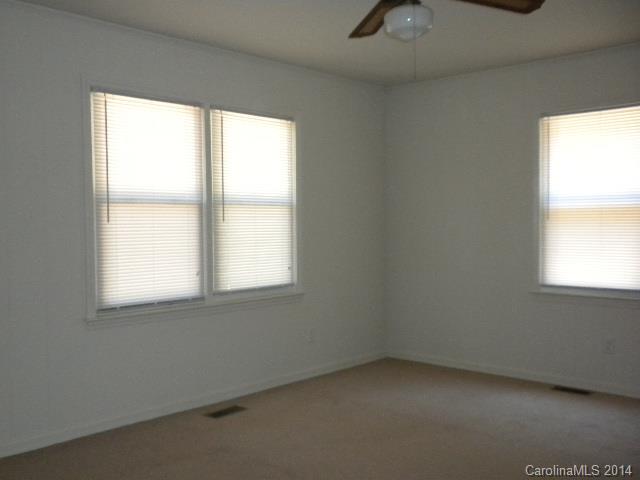 6918 Medlin Road Monroe, NC 28112 - Photo 3 of 11 an empty room with a window