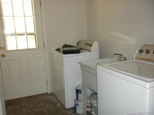 6918 Medlin Road Monroe, NC 28112 - Photo 6 of 11 a utility room with dryer and washer